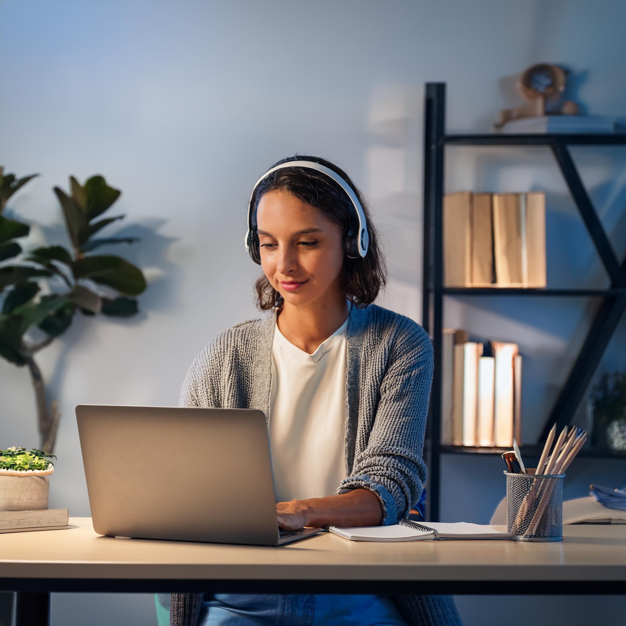 Picture of a woman taking a course at her own pace online.